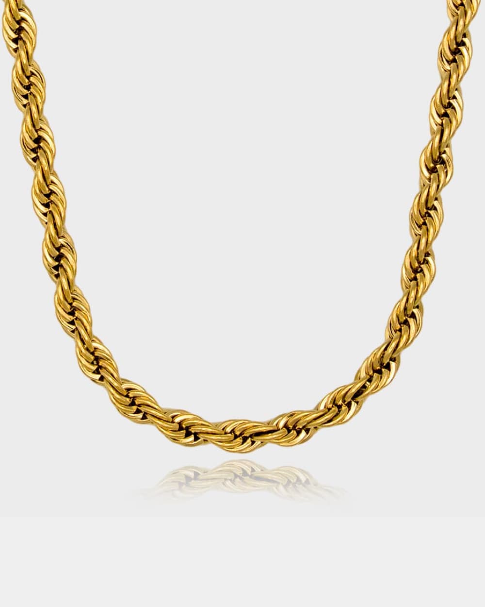 Gold rope chain necklace on a white background