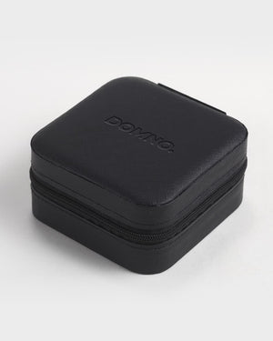 Black jewelry case with 'DOMNO' branding on a white background